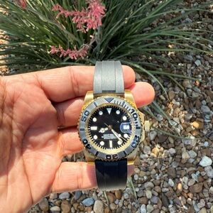 Gold and Black Watch with Gray Strap